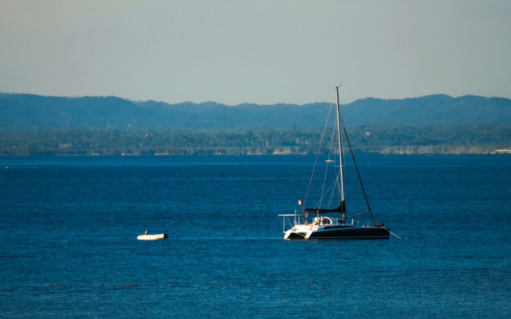 Affordable summer destination in Europe with turquoise sea and sailing boat